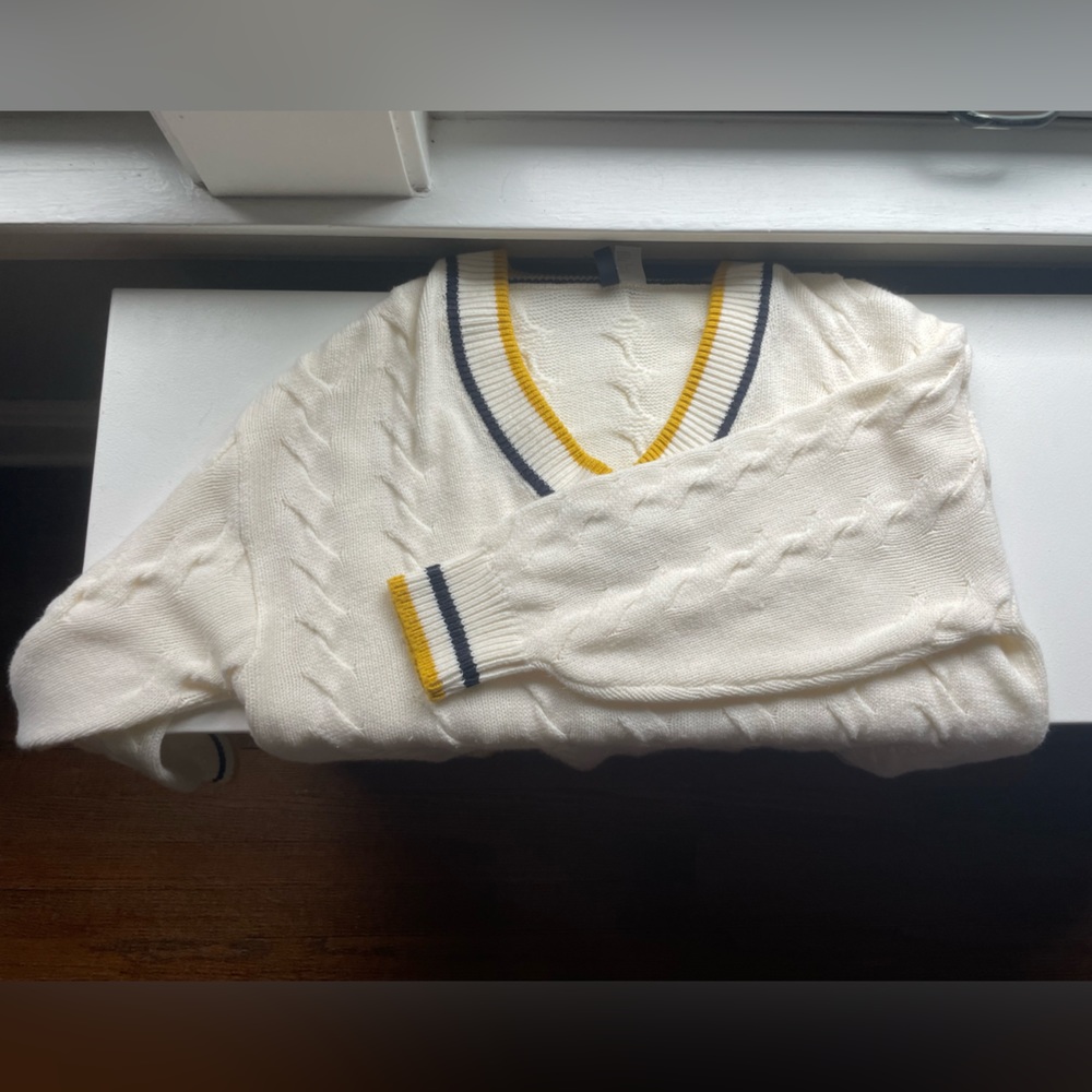 Cream color vasity v- neck sweater. oversized but size medium.